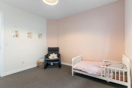 196 Jumping Pound Terrace, Cochrane, AB - Indoor Photo Showing Bedroom