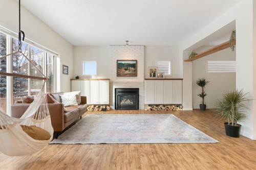 196 Jumping Pound Terrace, Cochrane, AB - Indoor Photo Showing Living Room With Fireplace