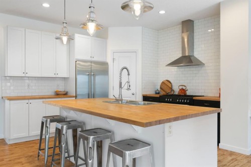 196 Jumping Pound Terrace, Cochrane, AB - Indoor Photo Showing Kitchen With Upgraded Kitchen