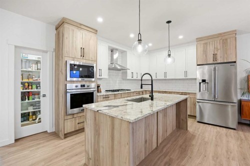 22 Hanson Drive Ne, Langdon, AB - Indoor Photo Showing Kitchen With Upgraded Kitchen