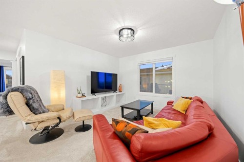 22 Hanson Drive Ne, Langdon, AB - Indoor Photo Showing Living Room