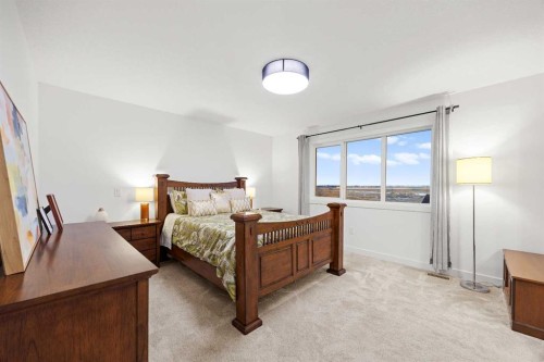 22 Hanson Drive Ne, Langdon, AB - Indoor Photo Showing Bedroom