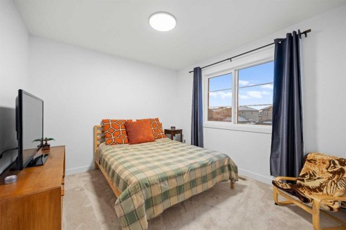 22 Hanson Drive Ne, Langdon, AB - Indoor Photo Showing Bedroom