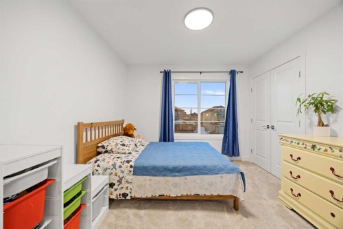 22 Hanson Drive Ne, Langdon, AB - Indoor Photo Showing Bedroom