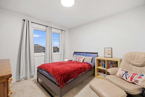 22 Hanson Drive Ne, Langdon, AB - Indoor Photo Showing Bedroom