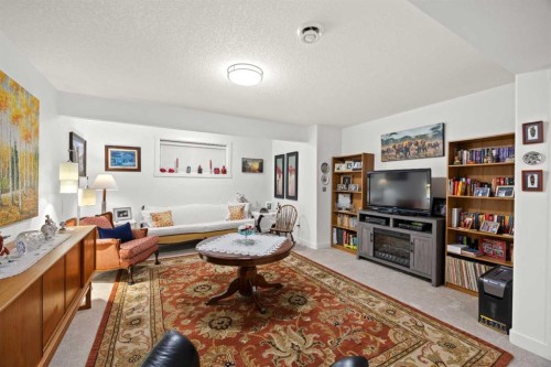 22 Hanson Drive Ne, Langdon, AB - Indoor Photo Showing Living Room