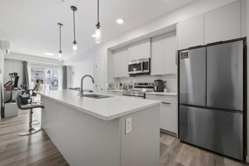 1104-220 Seton Grove Se, Calgary, AB - Indoor Photo Showing Kitchen With Upgraded Kitchen