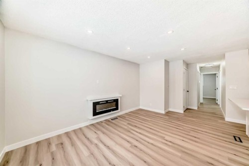 937 Marcombe Drive Ne, Calgary, AB - Indoor With Fireplace