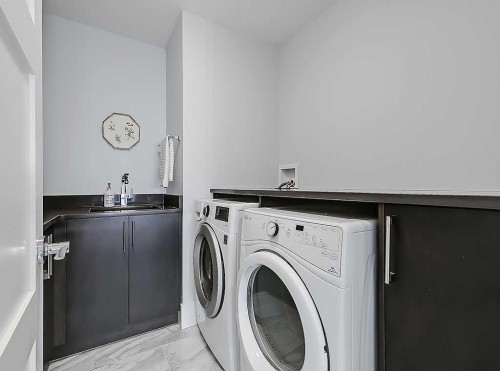 14 Rosetree Road Nw, Calgary, AB - Indoor Photo Showing Laundry Room