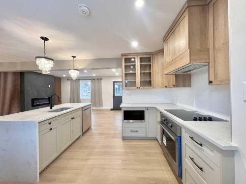 146 Springwood Drive Sw, Calgary, AB - Indoor Photo Showing Kitchen With Upgraded Kitchen