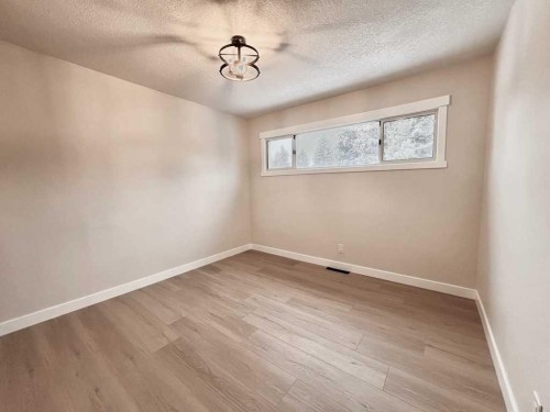 146 Springwood Drive Sw, Calgary, AB - Indoor Photo Showing Other Room
