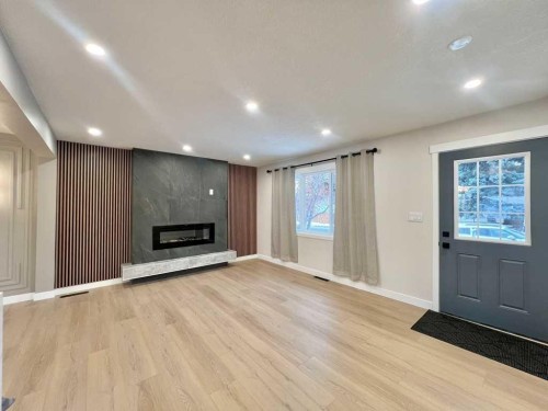 146 Springwood Drive Sw, Calgary, AB - Indoor With Fireplace
