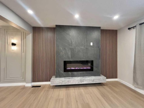 146 Springwood Drive Sw, Calgary, AB - Indoor With Fireplace