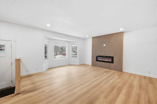 2404 51 Street Ne, Calgary, AB - Indoor Photo Showing Living Room With Fireplace