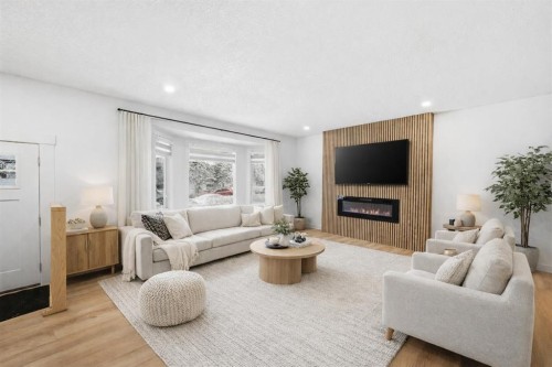2404 51 Street Ne, Calgary, AB - Indoor Photo Showing Living Room With Fireplace