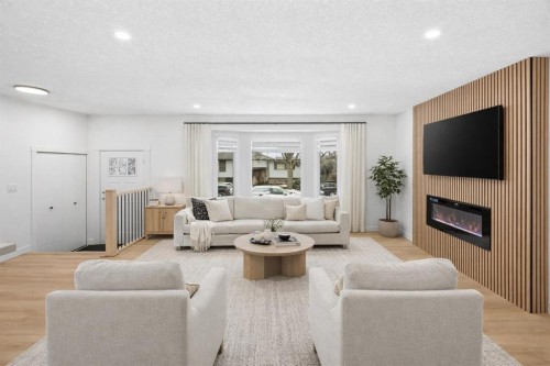 2404 51 Street Ne, Calgary, AB - Indoor Photo Showing Living Room With Fireplace