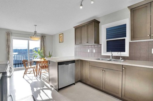 608 Windbrook Heights Sw, Airdrie, AB - Indoor Photo Showing Kitchen With Double Sink