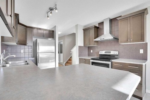 608 Windbrook Heights Sw, Airdrie, AB - Indoor Photo Showing Kitchen With Double Sink