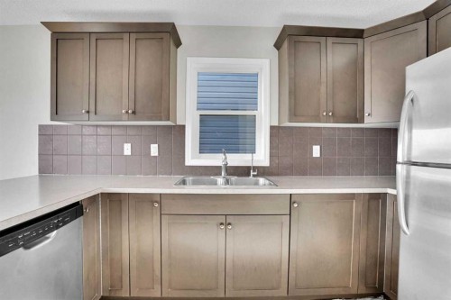 608 Windbrook Heights Sw, Airdrie, AB - Indoor Photo Showing Kitchen With Double Sink
