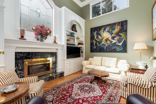 2003 Bay Shore Road Sw, Calgary, AB - Indoor Photo Showing Living Room With Fireplace