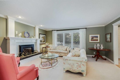 2003 Bay Shore Road Sw, Calgary, AB - Indoor Photo Showing Living Room With Fireplace