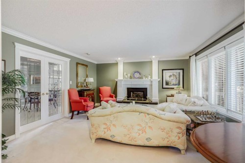 2003 Bay Shore Road Sw, Calgary, AB - Indoor Photo Showing Living Room With Fireplace