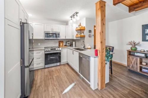 3-809 5Th Street, Canmore, AB - Indoor Photo Showing Kitchen With Double Sink