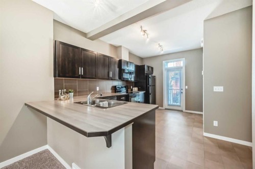 236 New Brighton Row Se, Calgary, AB - Indoor Photo Showing Kitchen With Double Sink