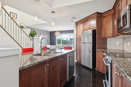 15 New Brighton Common Se, Calgary, AB - Indoor Photo Showing Kitchen With Double Sink With Upgraded Kitchen