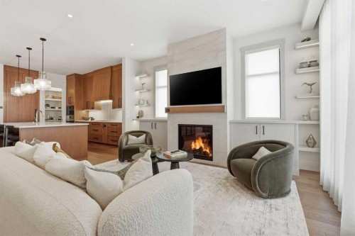 733 Serenity Bend, Heritage Pointe, AB - Indoor Photo Showing Living Room With Fireplace