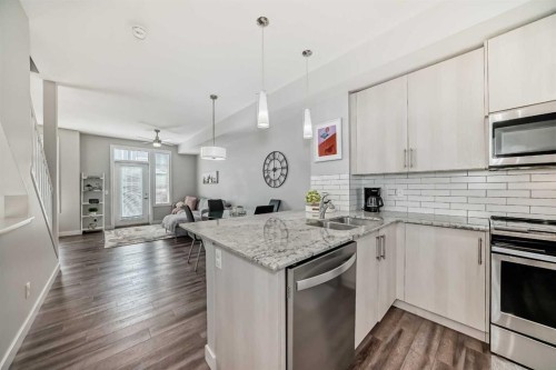 63 Legacy Path Se, Calgary, AB - Indoor Photo Showing Kitchen With Stainless Steel Kitchen With Double Sink With Upgraded Kitchen