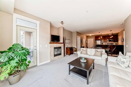 4304-24 Hemlock Crescent Sw, Calgary, AB - Indoor Photo Showing Living Room With Fireplace