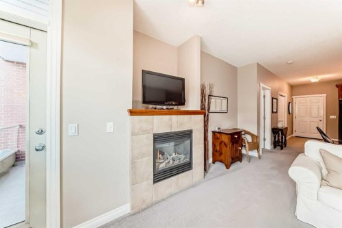 4304-24 Hemlock Crescent Sw, Calgary, AB - Indoor With Fireplace