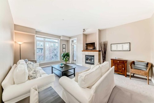 4304-24 Hemlock Crescent Sw, Calgary, AB - Indoor Photo Showing Living Room With Fireplace