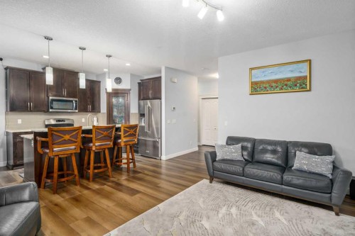 254 Silverado Plains Circle Sw, Calgary, AB - Indoor Photo Showing Living Room