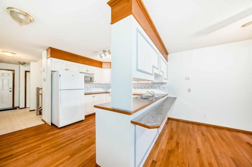 1-642 Mcdougall Road Ne, Calgary, AB - Indoor Photo Showing Kitchen With Double Sink