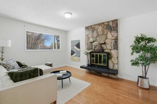 3703 Valdes Place Nw, Calgary, AB - Indoor Photo Showing Living Room With Fireplace