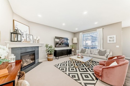 293 Everridge Drive Sw, Calgary, AB - Indoor Photo Showing Living Room With Fireplace