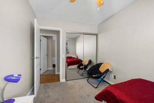 901-2520 Palliser Drive Sw, Calgary, AB - Indoor Photo Showing Bedroom