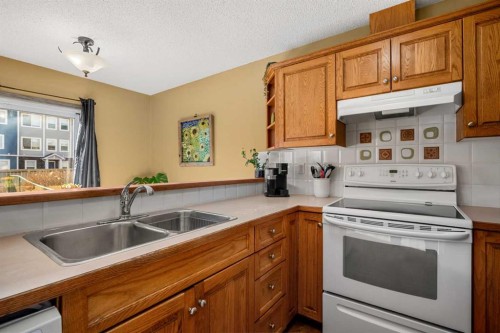 132 Bow Ridge Drive, Cochrane, AB - Indoor Photo Showing Kitchen With Double Sink