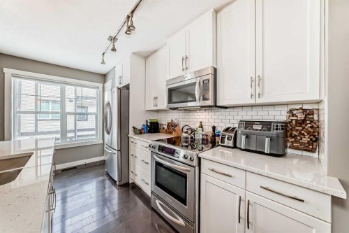 105 Mckenzie Towne Square Se, Calgary, AB - Indoor Photo Showing Kitchen With Stainless Steel Kitchen With Upgraded Kitchen
