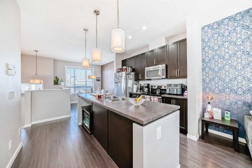 656 Copperpond Boulevard Se, Calgary, AB - Indoor Photo Showing Kitchen With Double Sink With Upgraded Kitchen
