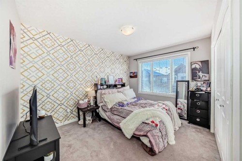 656 Copperpond Boulevard Se, Calgary, AB - Indoor Photo Showing Bedroom