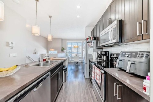 656 Copperpond Boulevard Se, Calgary, AB - Indoor Photo Showing Kitchen With Double Sink With Upgraded Kitchen
