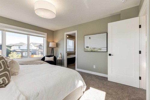 128 Quartz Crescent, Cochrane, AB - Indoor Photo Showing Bedroom