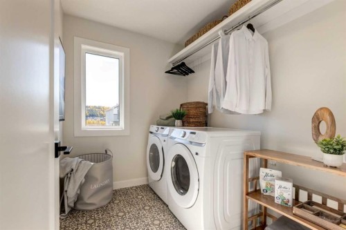 128 Quartz Crescent, Cochrane, AB - Indoor Photo Showing Laundry Room