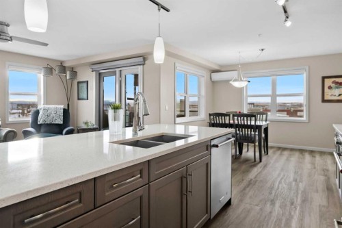 2310-10 Market Boulevard Se, Airdrie, AB - Indoor Photo Showing Kitchen With Double Sink