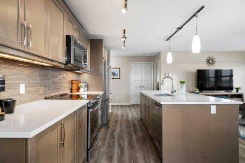 2310-10 Market Boulevard Se, Airdrie, AB - Indoor Photo Showing Kitchen With Upgraded Kitchen
