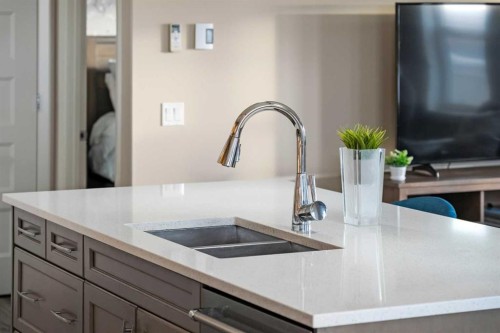 2310-10 Market Boulevard Se, Airdrie, AB - Indoor Photo Showing Kitchen With Double Sink