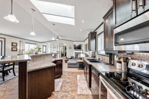 4 Spring Dale Circle Se, Airdrie, AB - Indoor Photo Showing Kitchen With Double Sink